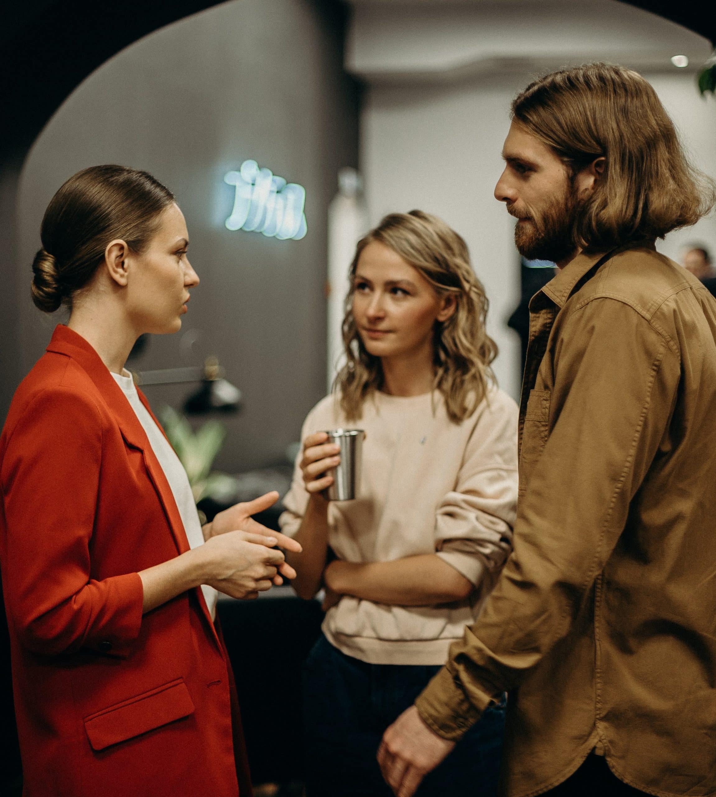 two women and man talking 3201718